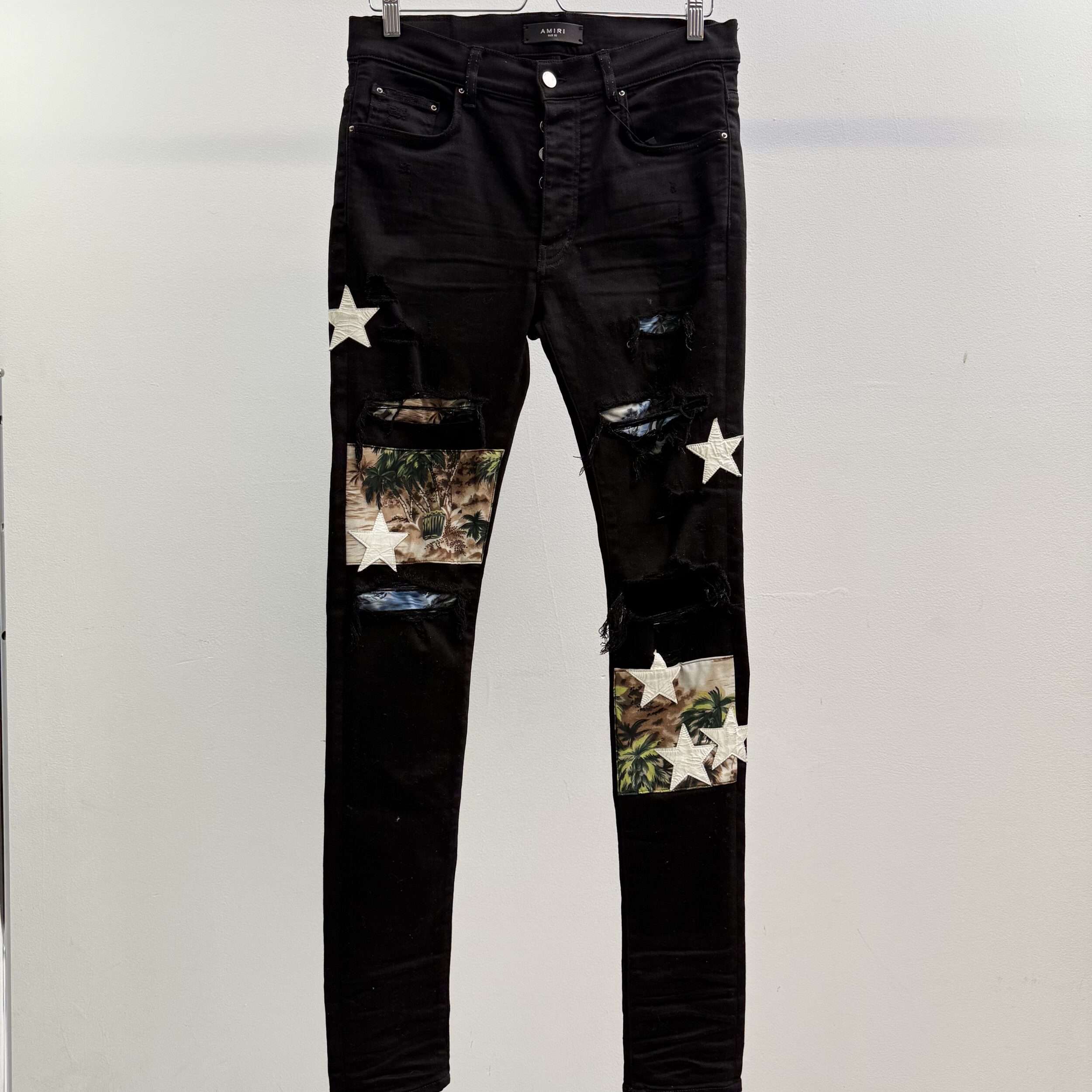 Amiri Tropical Star Patch Distressed Jeans